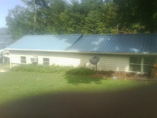 Blue metal roof running the length of a single story home in Montana Mines