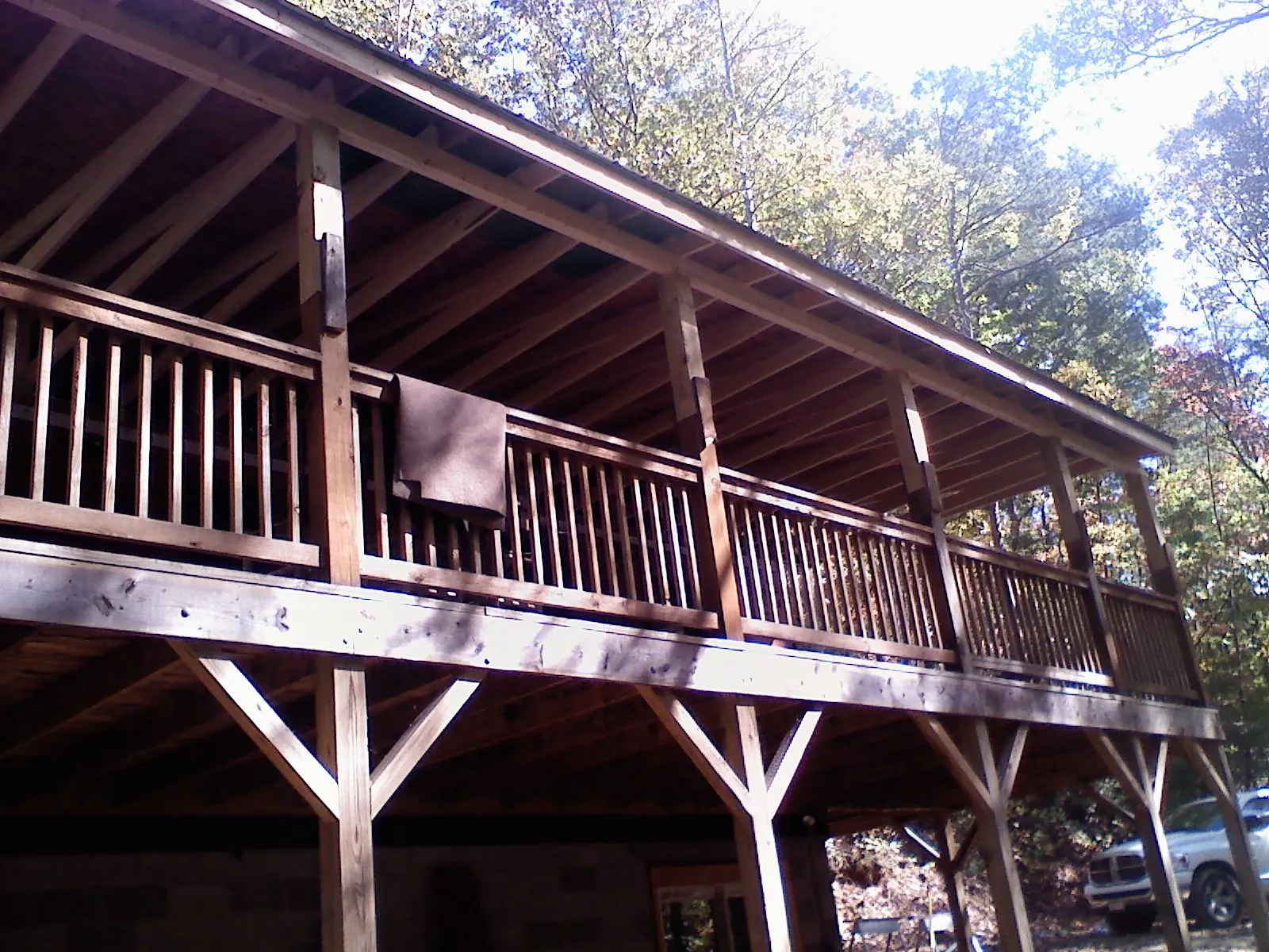 Timber framing under a new elevated porch and deck — Roof Leak Repair in Montana Mines by Roofing Brothers